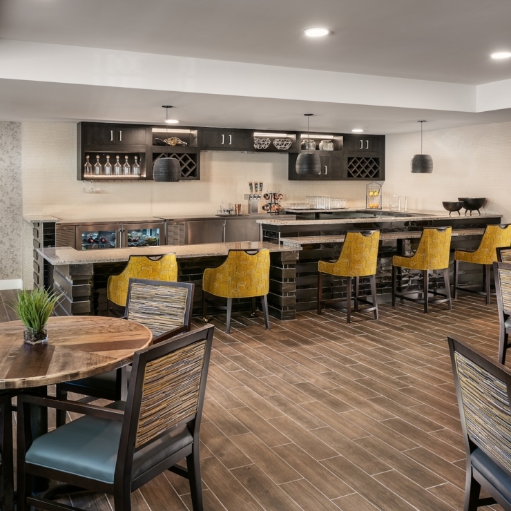 A welcoming common area featuring vibrant seating and a friendly atmosphere, perfect for gatherings.