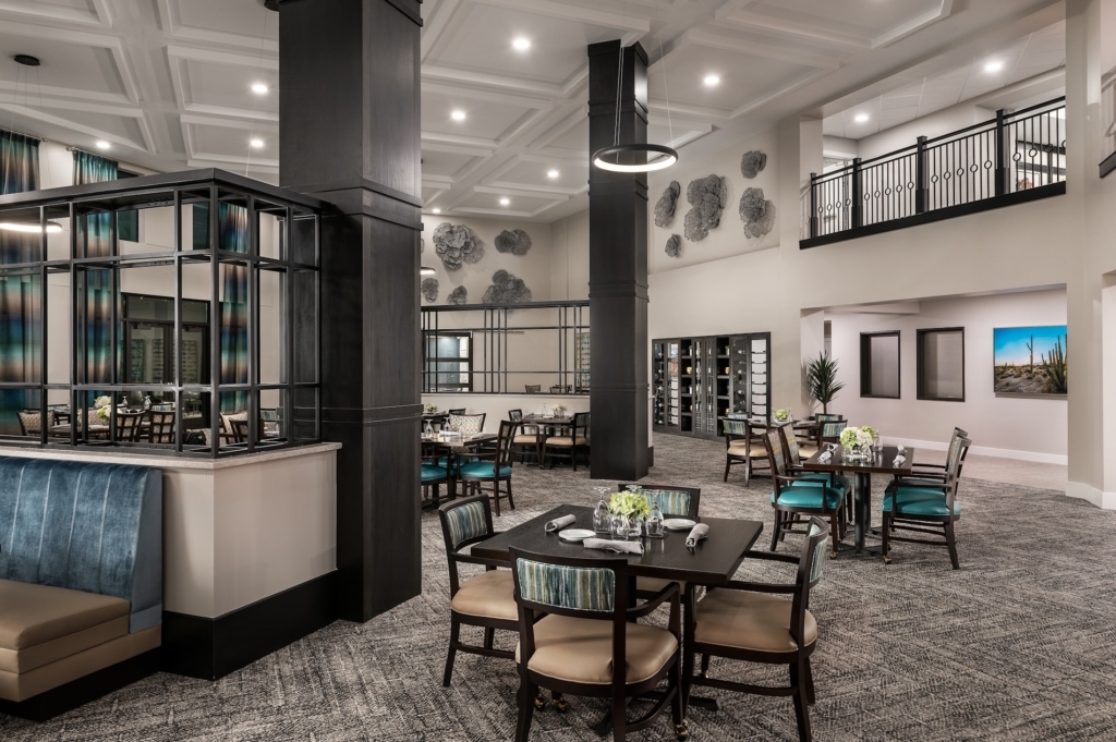 A welcoming dining area designed for community gatherings, featuring elegant decor and comfortable seating.