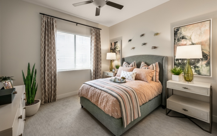 A cozy, inviting bedroom filled with natural light, perfect for relaxation and comfort in community living.