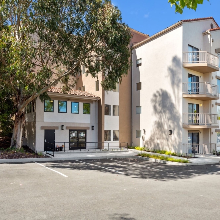 Nestled among lush trees, this community offers a welcoming atmosphere and inviting architecture.