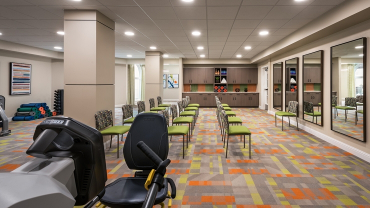 A welcoming fitness area filled with vibrant colors, promoting community and active living.