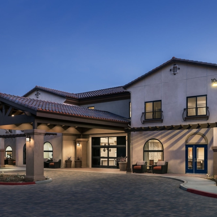 A welcoming entrance with cozy seating invites residents to enjoy a serene community atmosphere.