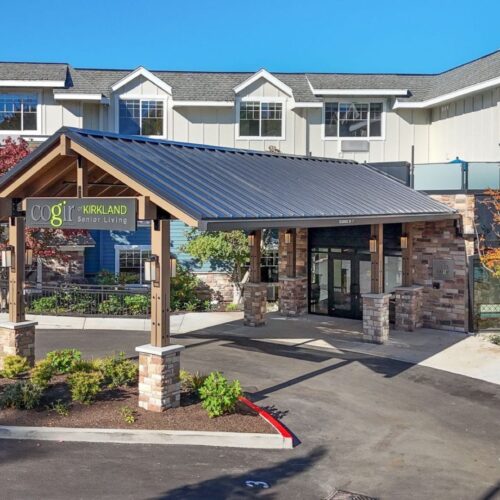 Welcoming entryway to a serene community, showcasing beautiful landscaping and a sense of belonging.