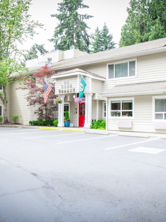 A welcoming entrance surrounded by greenery, fostering a sense of community and comfort.