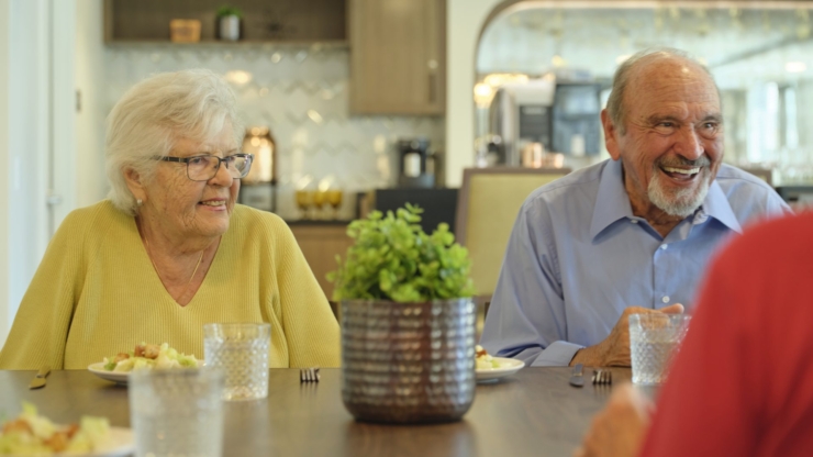 Warm smiles and lively conversation fill the inviting dining area, fostering community and joy.