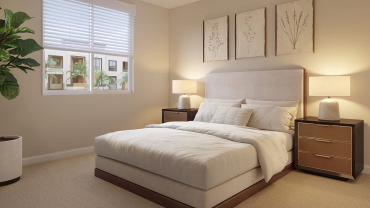 A cozy bedroom filled with natural light, offering comfort and a welcoming atmosphere for residents.