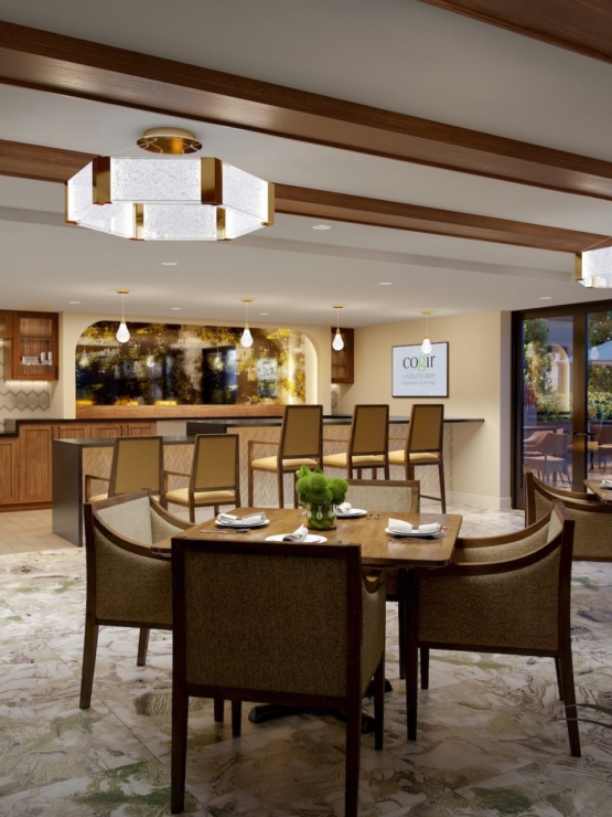 A warm, inviting dining space fosters community, featuring elegant furnishings and natural light.