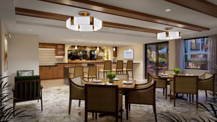 A warm, inviting dining space fosters community, featuring elegant furnishings and natural light.