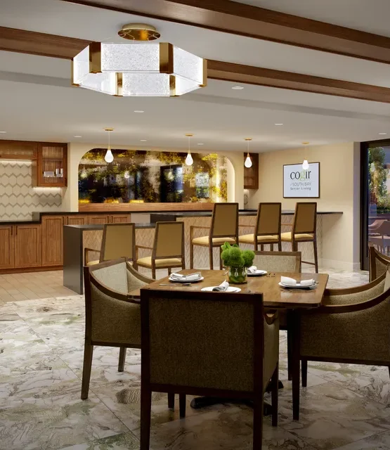 A welcoming dining area features soft lighting, elegant decor, and inviting seating for community gatherings.