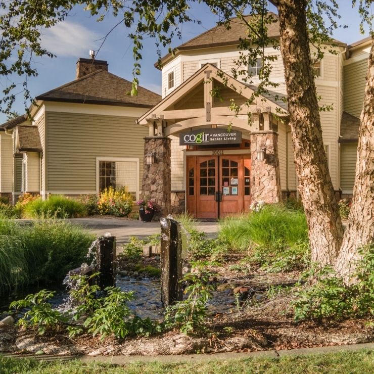 Welcoming entrance surrounded by lush greenery, fostering a warm community atmosphere for all.