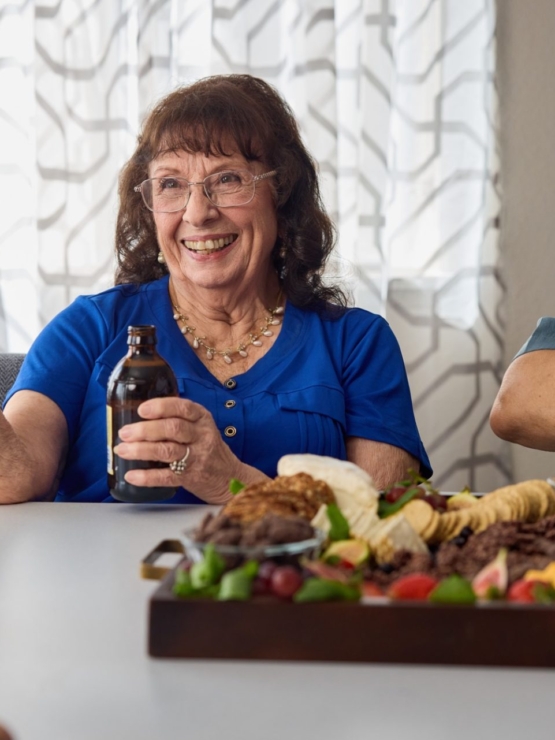 Lively interactions over cards and shared snacks create a joyful, welcoming atmosphere.