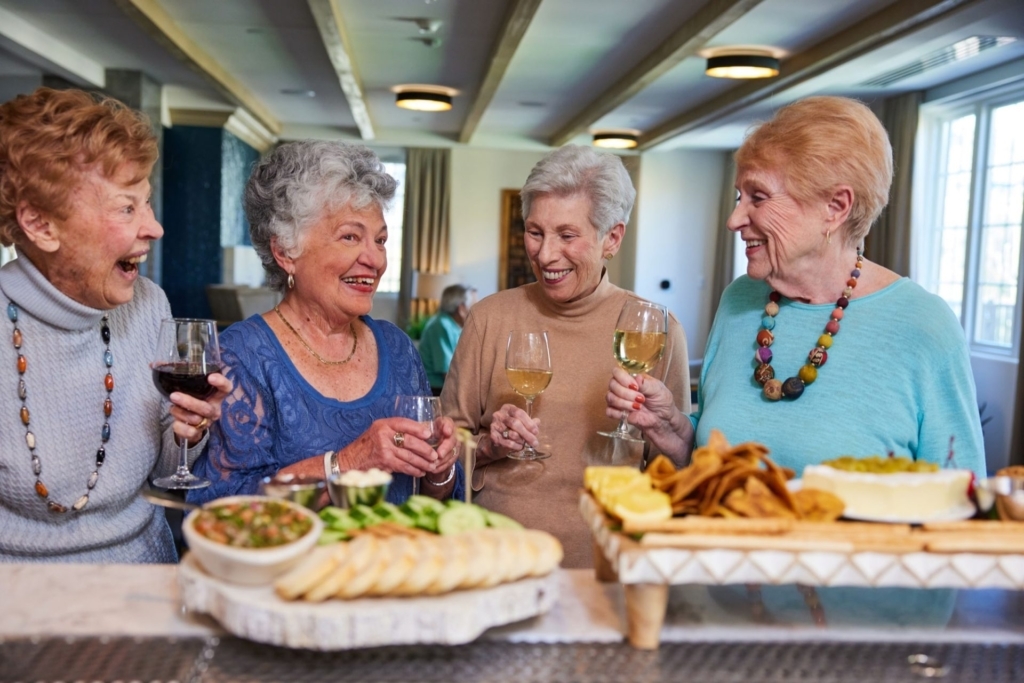 Laughter and joy fill the air as friends enjoy drinks and tasty treats in a welcoming community space.
