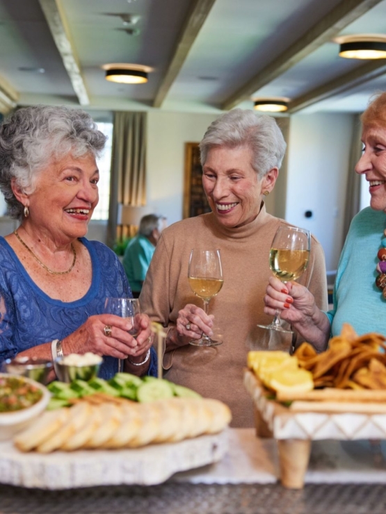 Laughter and joy fill the air as friends enjoy drinks and tasty treats in a welcoming community space.