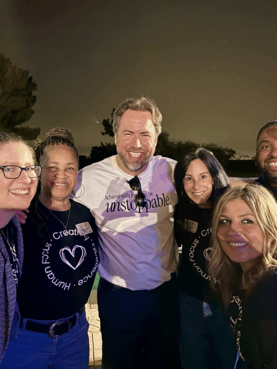 A joyful gathering of friendly faces, celebrating community and connection under a starlit sky.