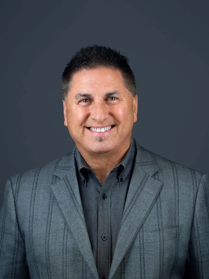 A warm smile radiates positivity, embodying the welcoming spirit of our vibrant community.