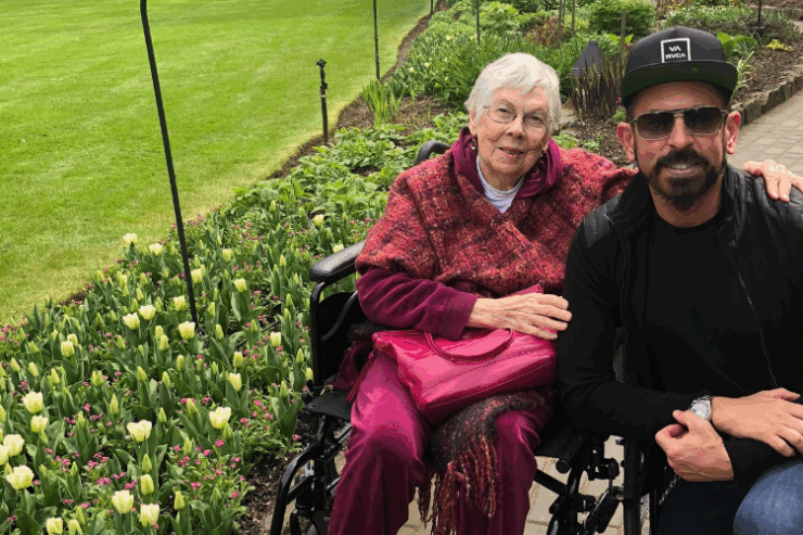 A joyful moment shared amidst vibrant gardens, highlighting warmth, community, and connection.