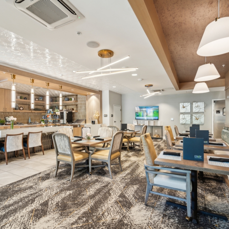 A welcoming dining area featuring elegant decor, inviting seating, and a warm, community atmosphere.