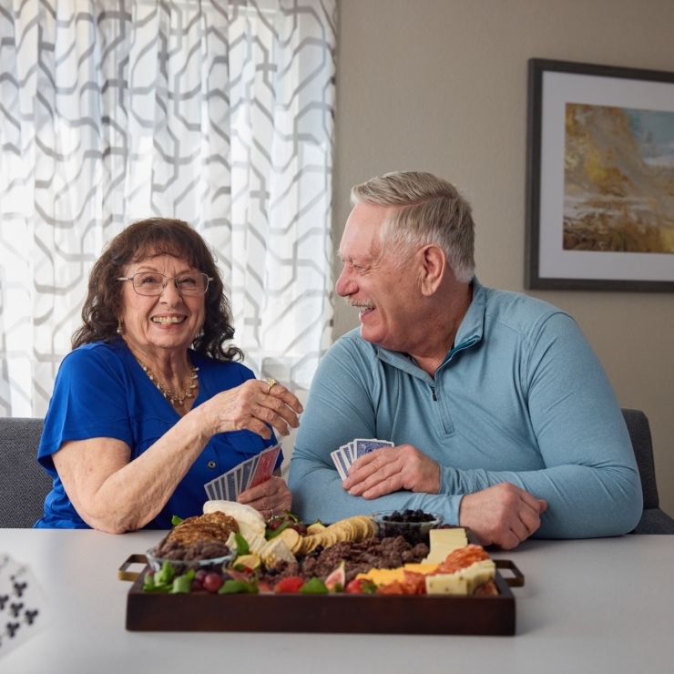 Two residents enjoy a delightful meal together, sharing laughter and warmth in a welcoming setting.