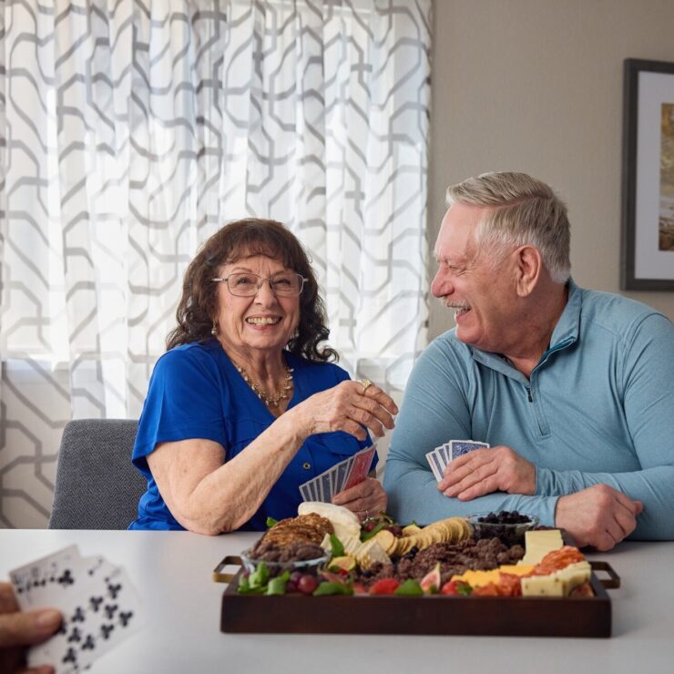 Two residents enjoy a delightful meal together, sharing laughter and warmth in a welcoming setting.