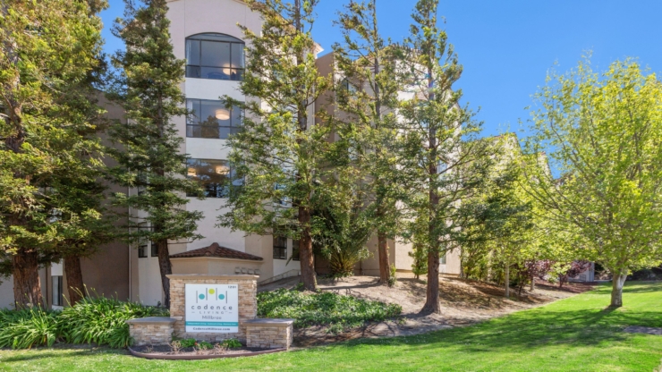 A welcoming residence nestled among lush greenery, inviting community and comfort for all.