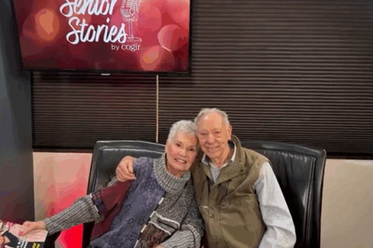 A warm scene showcasing two smiling residents enjoying each other's company, radiating joy and community.