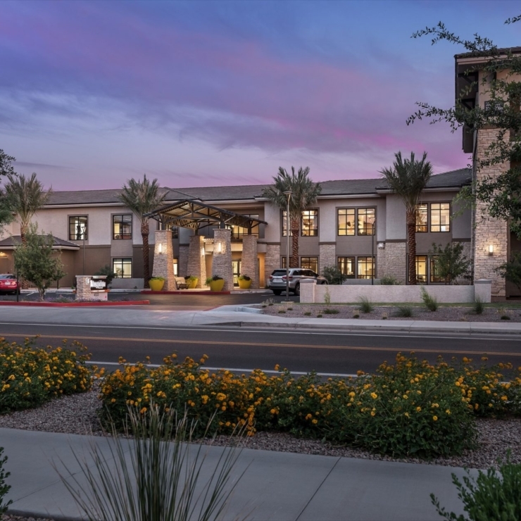 A welcoming community surrounded by vibrant gardens, inviting residents to enjoy comfort and companionship.