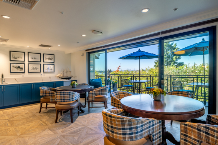 Welcoming lounge space with inviting seating and beautiful views, perfect for relaxation and community connection.