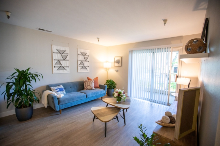 Bright and inviting living space, perfect for relaxation and community gatherings, with cozy decor.