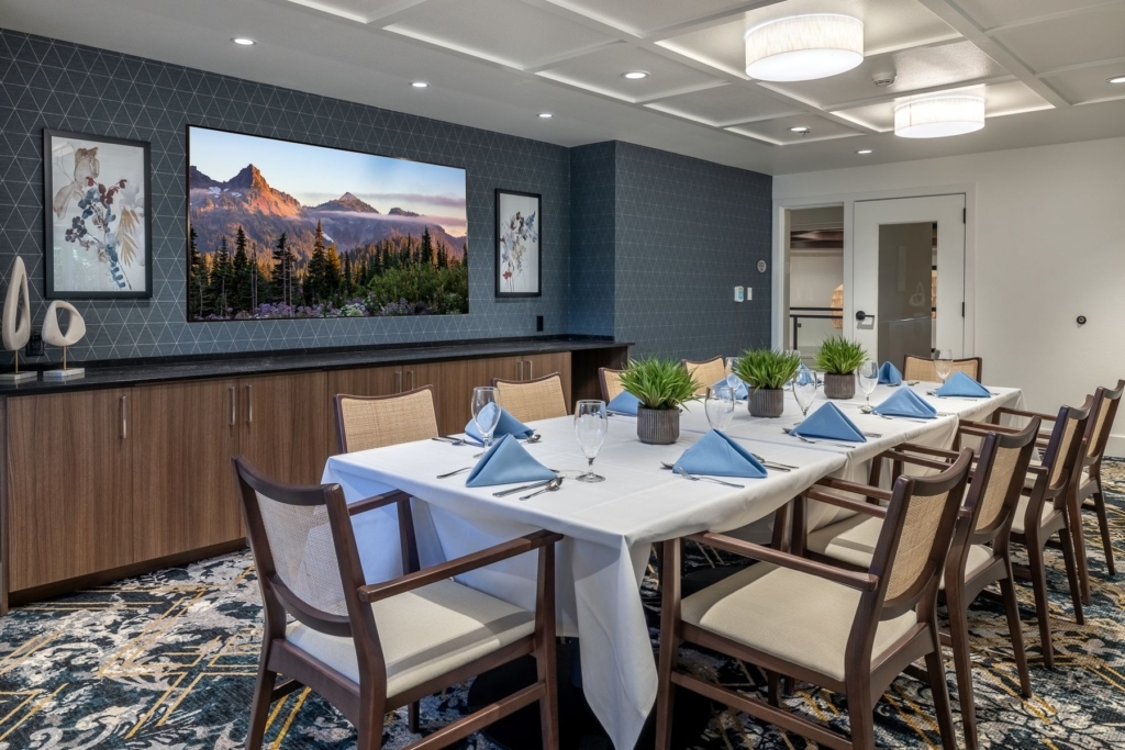 A welcoming dining area featuring a beautifully set table, perfect for community gatherings and shared meals.