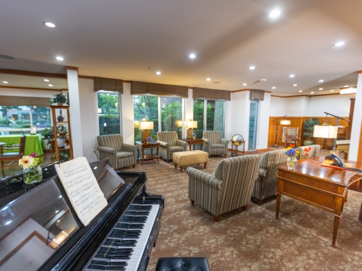 A welcoming lounge filled with natural light, inviting seating, and cheerful decor, perfect for community gatherings.