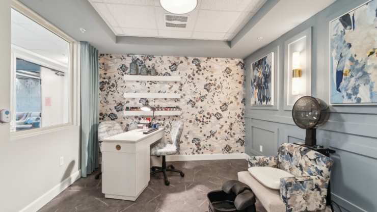 A bright, inviting salon space featuring elegant decor, perfect for relaxation and community bonding.