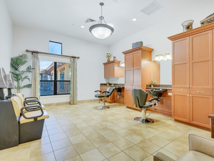 A welcoming salon space filled with natural light, perfect for relaxation and community gatherings.