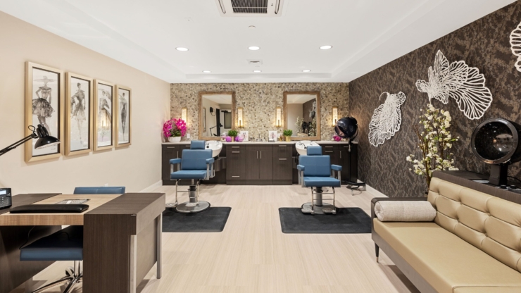 A bright, inviting salon space featuring stylish seating and elegant decor, fostering community and relaxation.