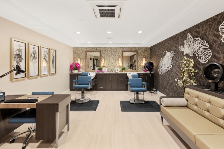 A bright, inviting salon space featuring stylish seating and elegant decor, fostering community and relaxation.