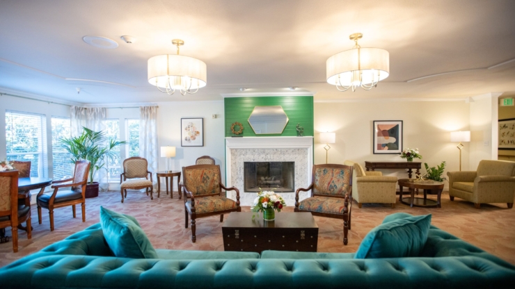 A cozy, inviting lounge filled with comfortable seating, warm lighting, and vibrant decor, perfect for community gatherings.