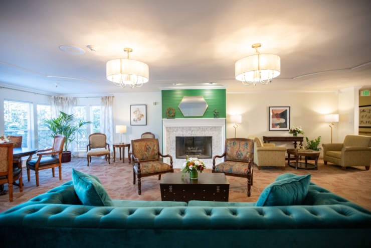 A cozy, inviting lounge filled with comfortable seating, warm lighting, and vibrant decor, perfect for community gatherings.
