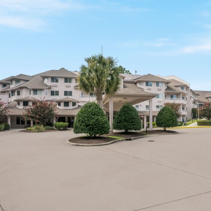 Welcoming community surrounded by lush greenery, providing a serene atmosphere for residents.