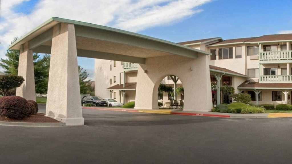 Welcoming entrance featuring lush greenery, inviting spaces, and a sense of community.