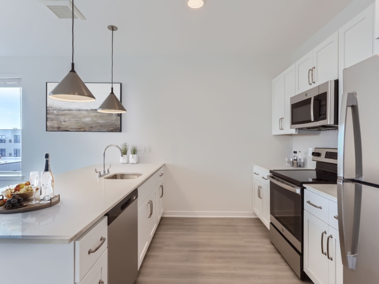 Bright and inviting kitchen, perfect for gatherings, with modern appliances and a warm, welcoming atmosphere.