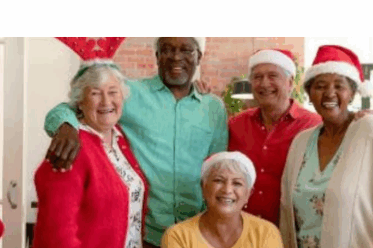 Warm smiles and festive hats create a joyful community atmosphere during the holiday season.