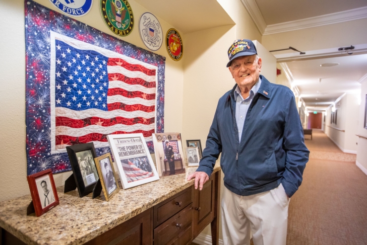 A warm, welcoming space showcasing community pride, featuring a smiling veteran by cherished memories.