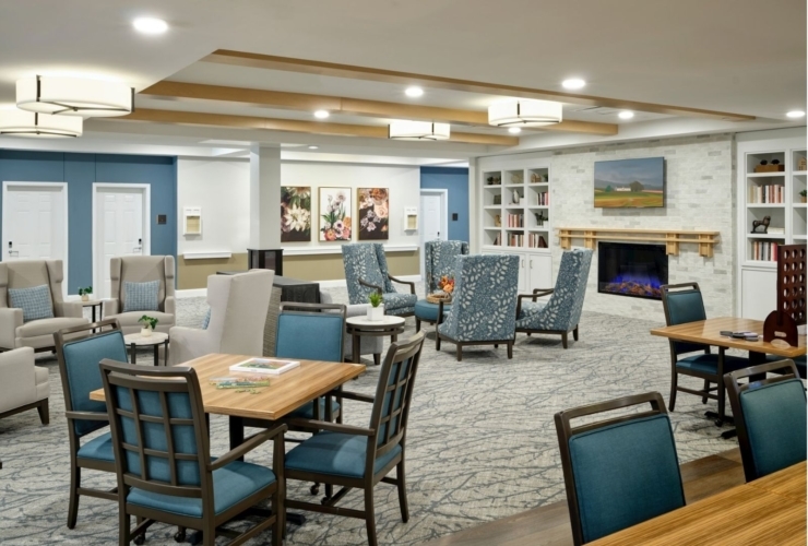 A welcoming community space featuring comfortable seating, warm decor, and inviting art for relaxation and connection.