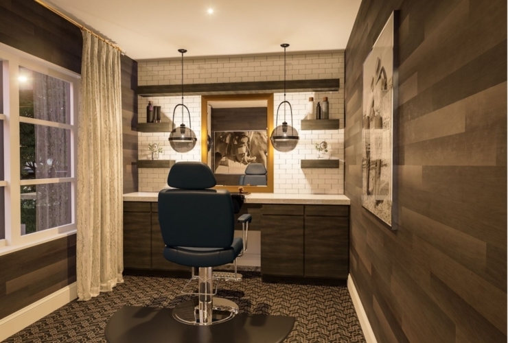 A welcoming salon space designed for relaxation, featuring elegant decor and comfortable seating.