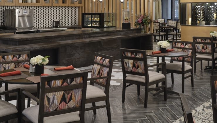 A welcoming dining area with elegant decor, inviting warmth and community spirit for all residents.