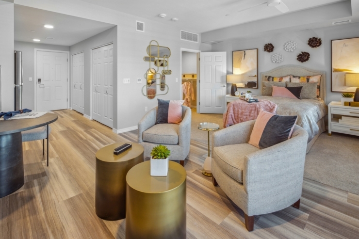 A welcoming suite featuring stylish seating, warm decor, and a serene atmosphere for community living.