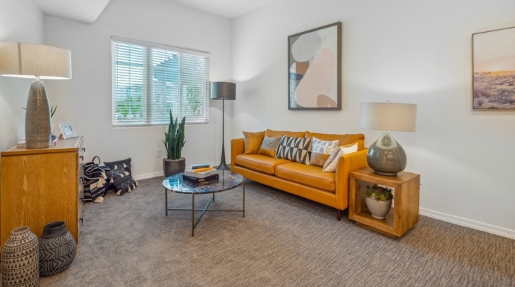 Bright and inviting, this warm space features comfortable seating and greenery, perfect for community gatherings.