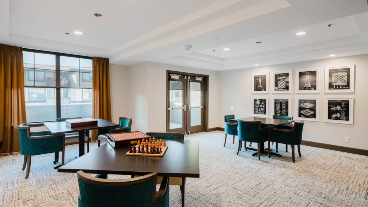 Bright, inviting space with cozy seating and games, perfect for socializing and relaxation.