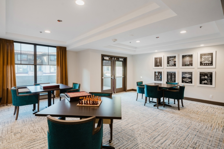 Bright, inviting space with cozy seating and games, perfect for socializing and relaxation.