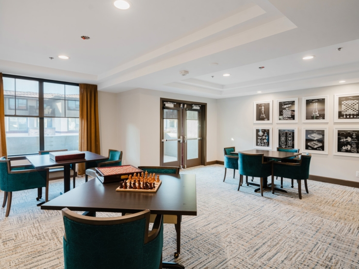 Bright, inviting space with cozy seating and games, perfect for socializing and relaxation.