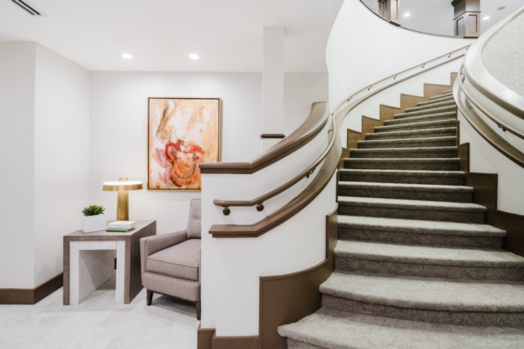 A welcoming lobby features elegant decor, inviting seating, and soft lighting, fostering community warmth.